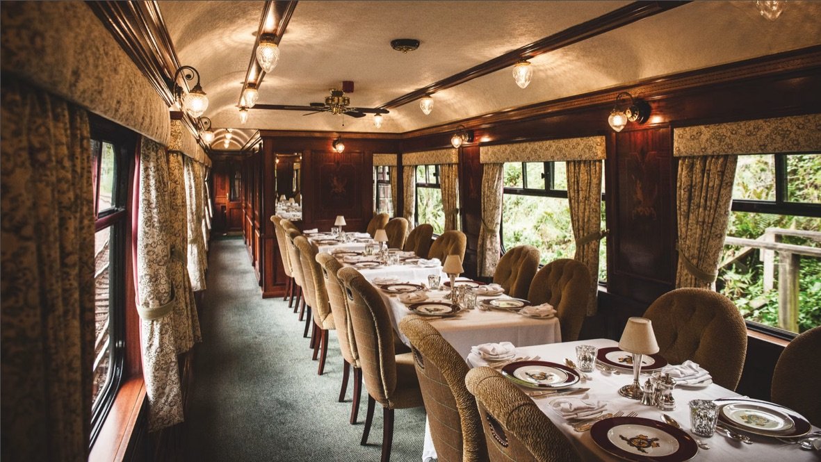 The dining car of the Royal Scotsman set for dinner on a Highland rail journey.