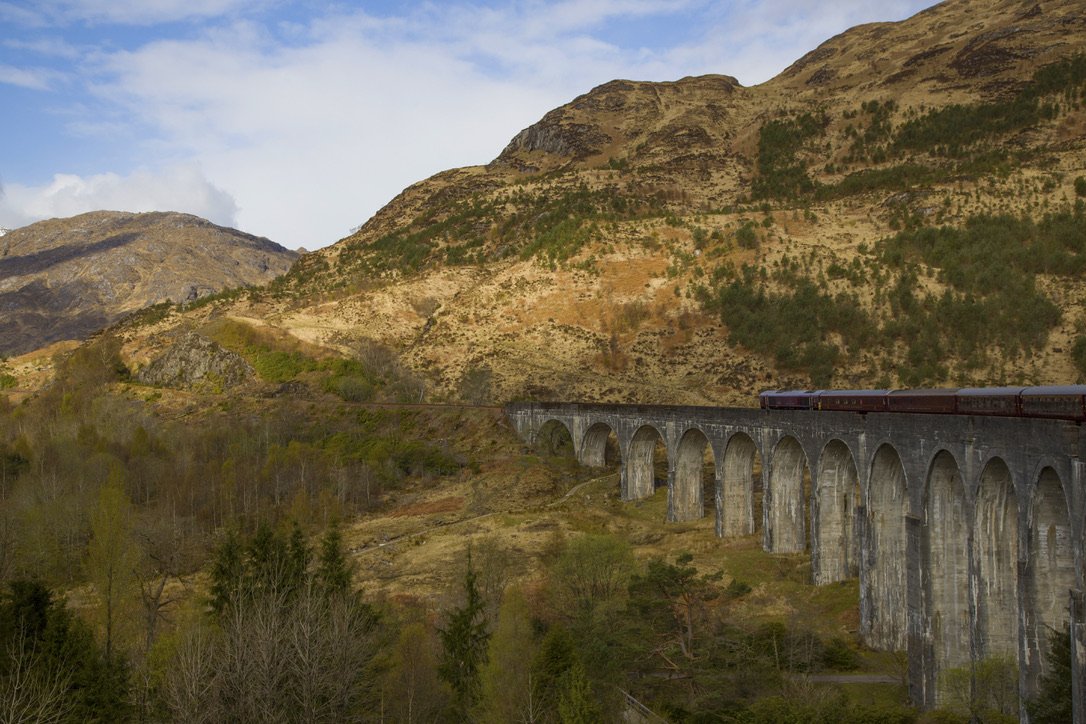 The Royal Scotsman crossing the Glenfinnan Viaduct in the Scottish Highlands.